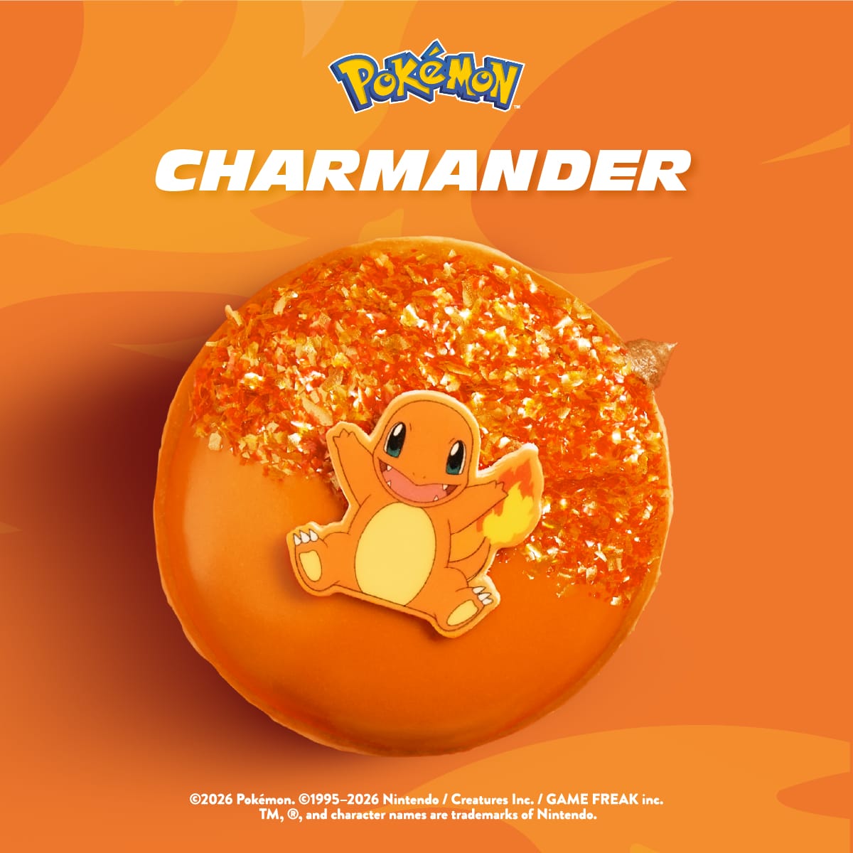 Dona Charmander de Krispy Kreme Ecuador, rellena de crema de chocolate con glaseado naranja y sprinkles rojos